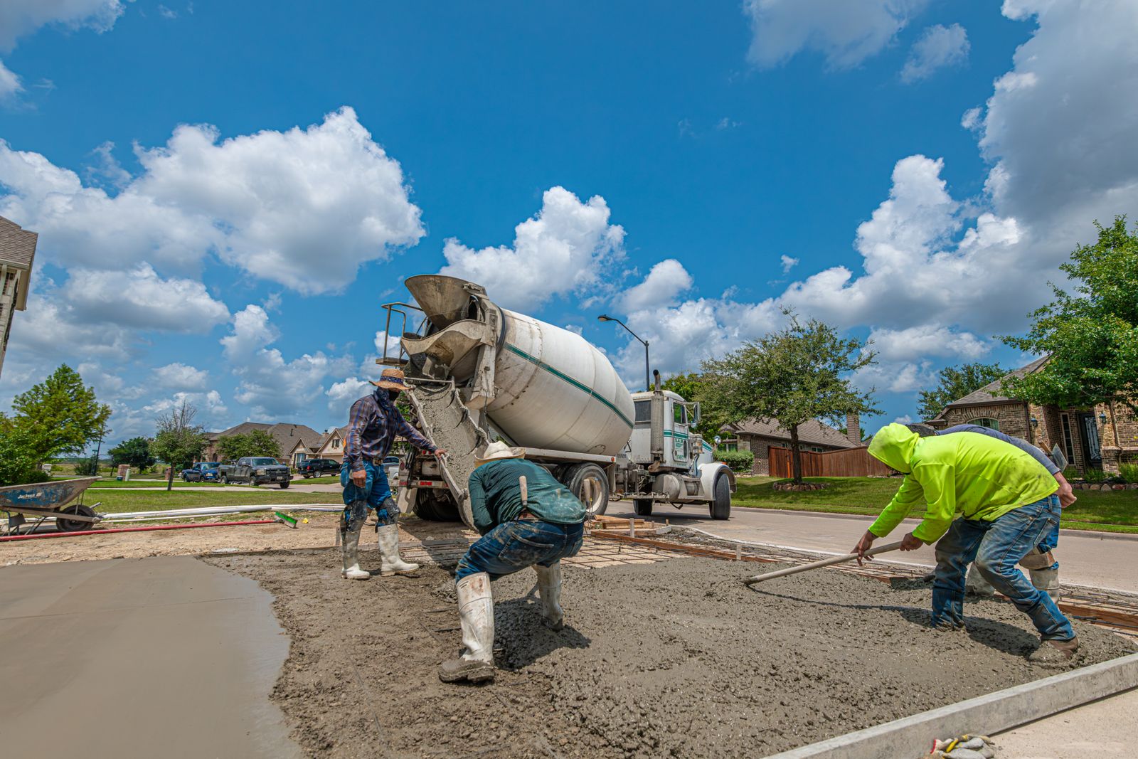 Concrete contractors pouring a residential driveway in the Fort Worth, TX area